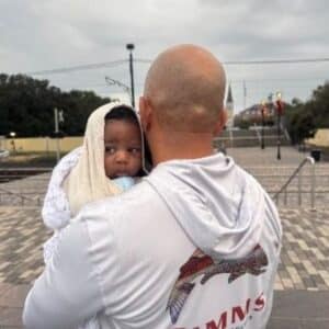 adoptive father