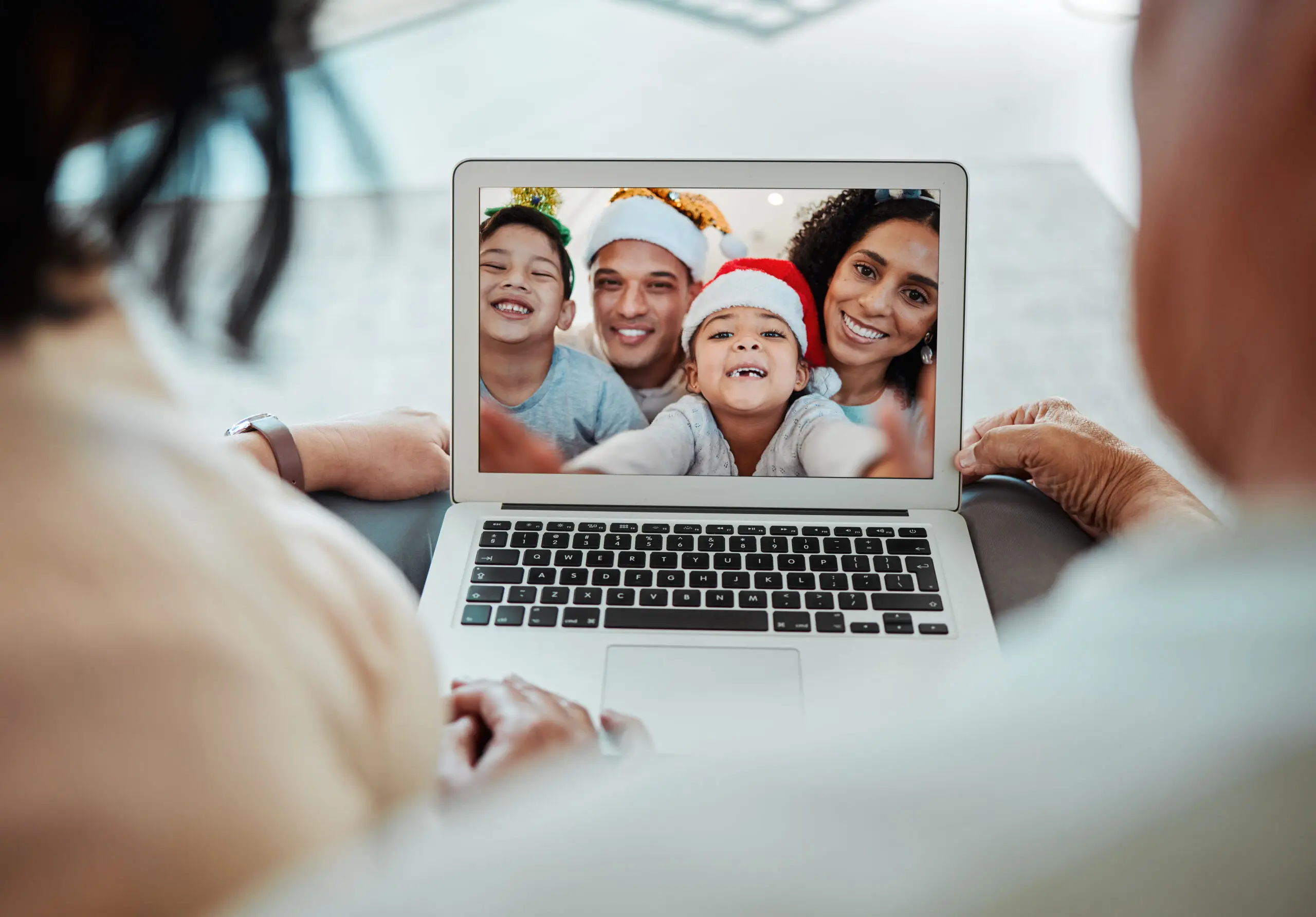 A family connecting with loved ones over a video call.
